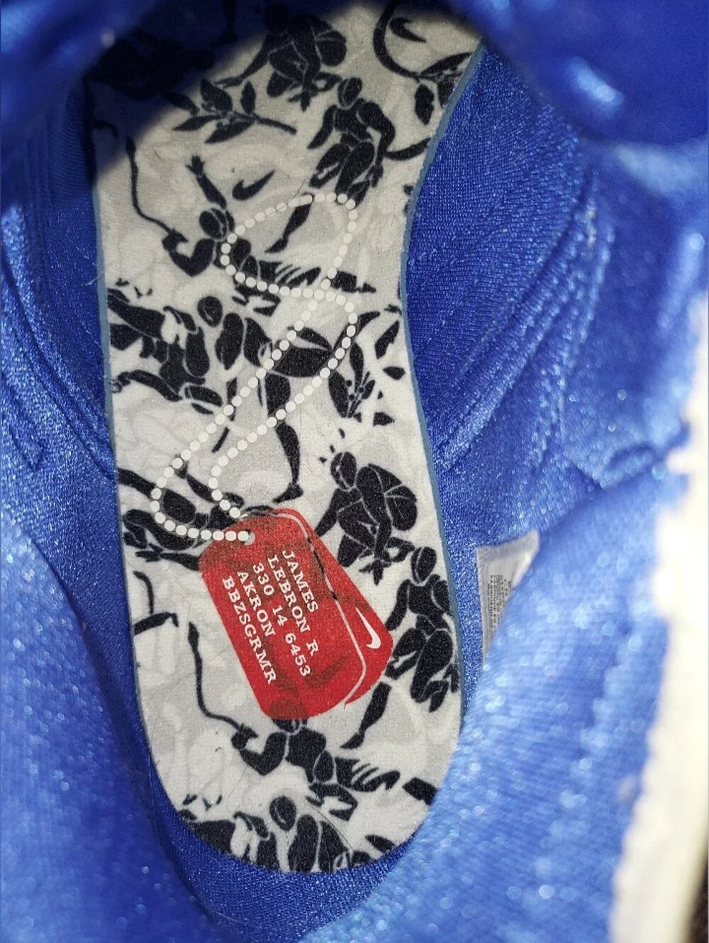 Nike Men’s White Floral Training Shoes with Black Print and Blue Details